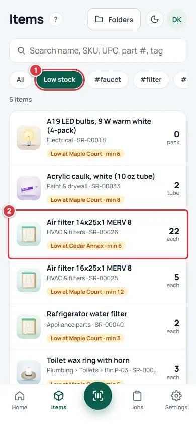 The Items screen on All locations with Low stock pressed. Mark 1 is the chip and mark 2 is an item that says Low at Cedar Annex even though the item has plenty at another location.
